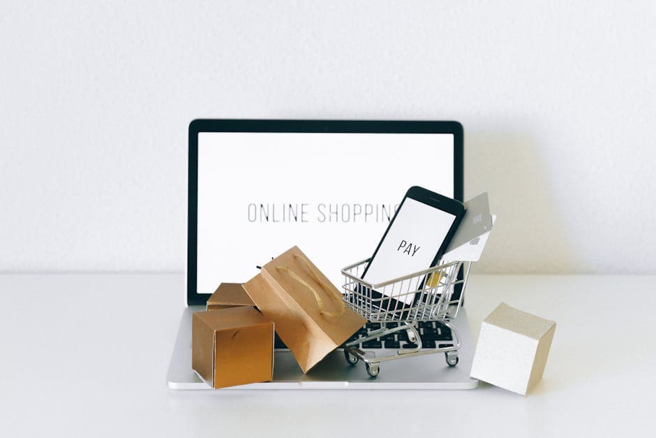 Online shopping cart and payment devices on laptop